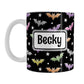 Personalized Colorful Bats Mug (11oz) at Amy's Coffee Mugs. A ceramic coffee mug designed with different colored bats and white stars in an assorted pattern over a black background color that wraps around the mug up to the handle. Your personalized name is custom-printed in black within a white rectangular frame design on both sides of the mug over the colorful bats background.