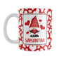 Personalized Cute White Hearts Red Gnome Mug (11oz) at Amy's Coffee Mug. A ceramic coffee mug designed with an adorable red gnome holding a red heart in a white rectangle on both sides of the mug over a pattern of cute white hearts over a red background that wraps around the mug to the handle. Your personalized name is custom printed in an all-capital letters red font below the heart-holding gnome.