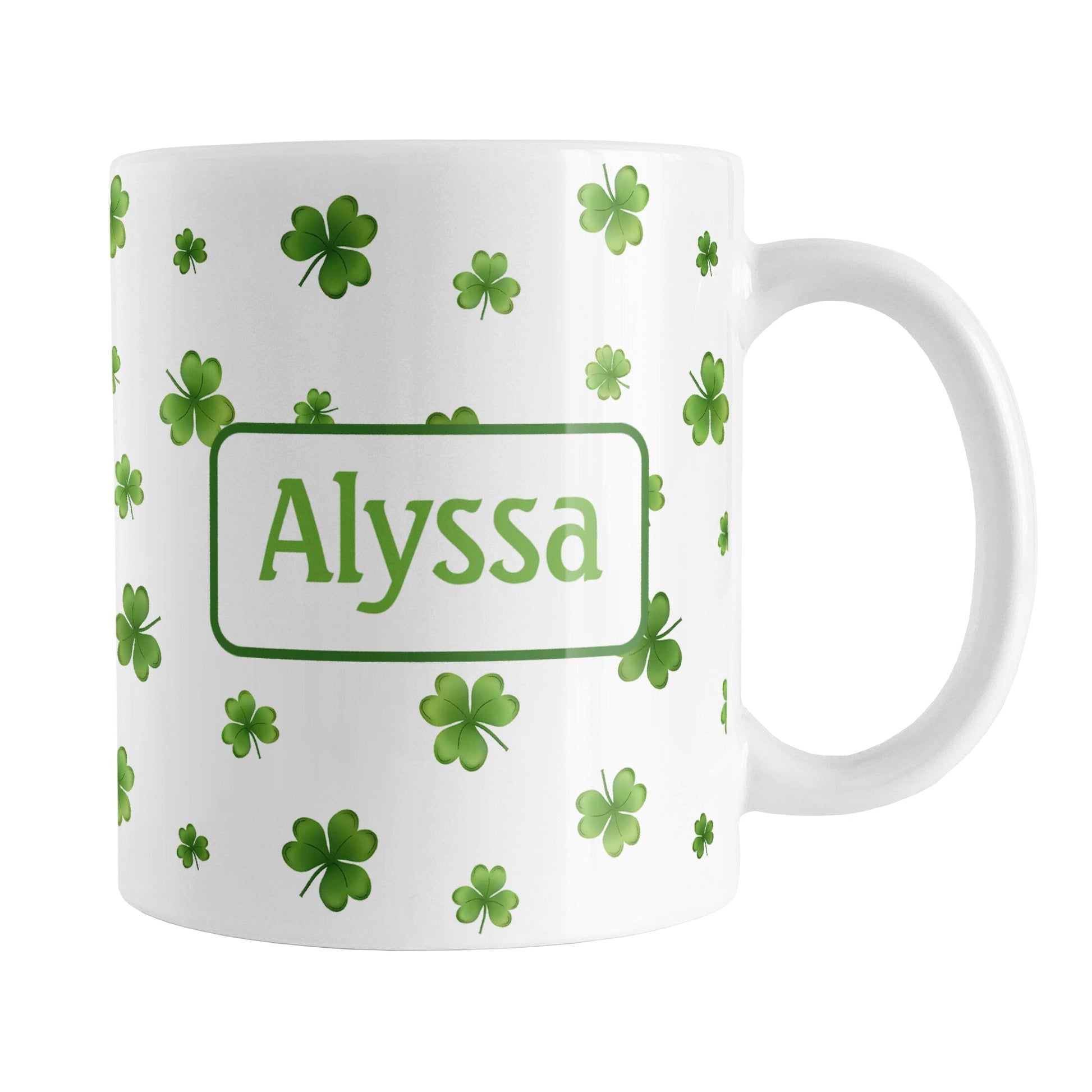 Personalized Dainty Shamrocks and Clovers Mug (11oz) at Amy's Coffee Mugs. A ceramic coffee mug designed with a print of hand-drawn green shamrocks and 4-leaf clovers in a dainty minimalist pattern that wraps around the mug up to the handle. Your personalized name is custom-printed on both sides of the mug in green.