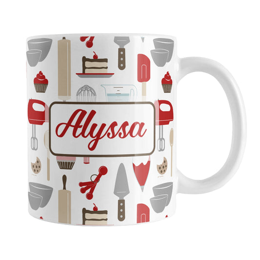 Personalized Red Baking Pattern Mug (11oz) at Amy's Coffee Mugs. A ceramic coffee mug designed with a pattern of baking tools like spatulas, whisks, mixers, bowls, and spoons, with cookies, cupcakes, and cake all in a red, gray, brown, and beige color scheme that wraps around the mug. Your name is printed in a red script font on both sides of the mug over the cute baking pattern.