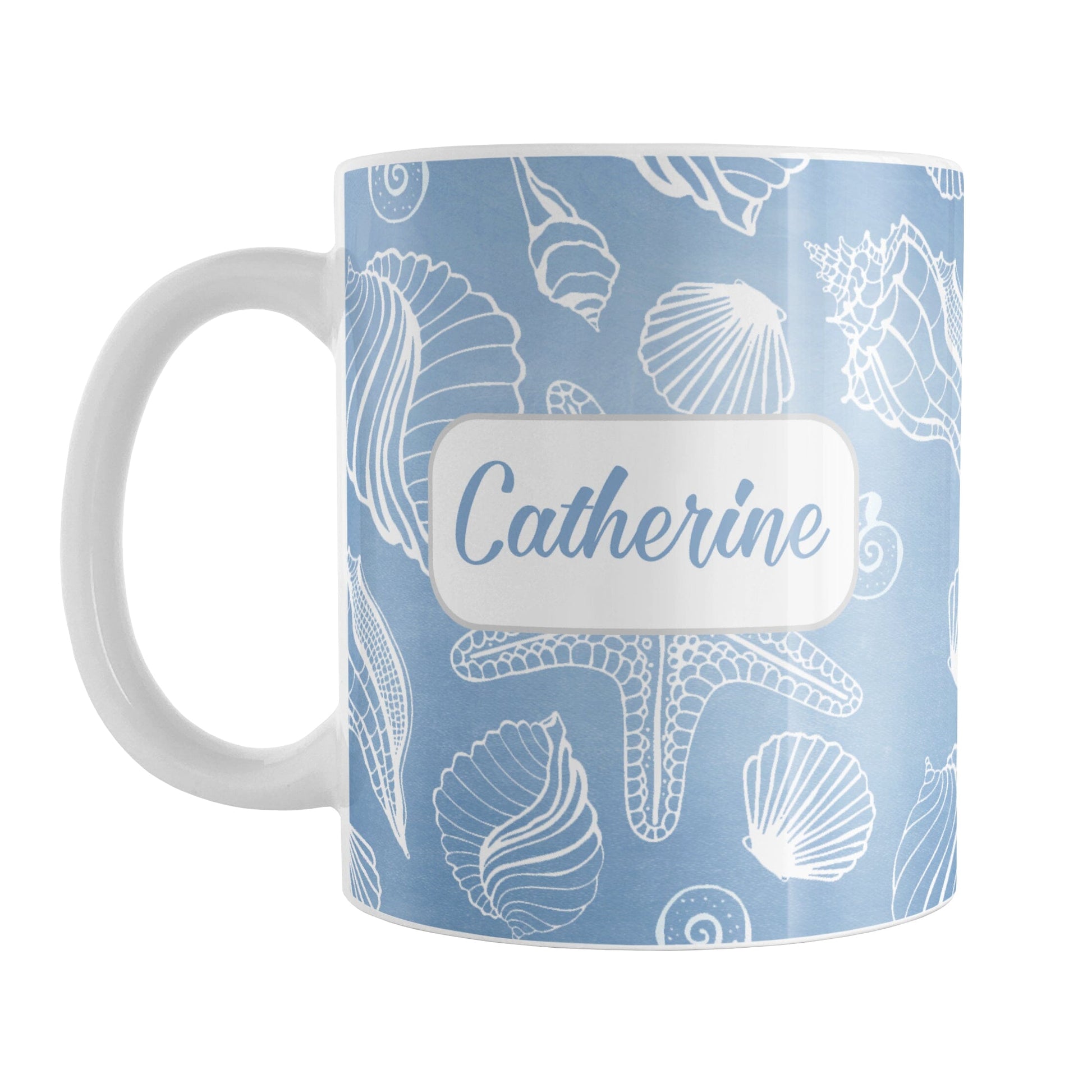 Personalized White Seashell Pattern Blue Beach Mug (11oz) at Amy's Coffee Mugs. A ceramic coffee mug designed with a white seashell line drawing pattern over a blue background that wraps around the mug up to the handle. Your name is personalized on this beach mug over the blue seashell pattern.