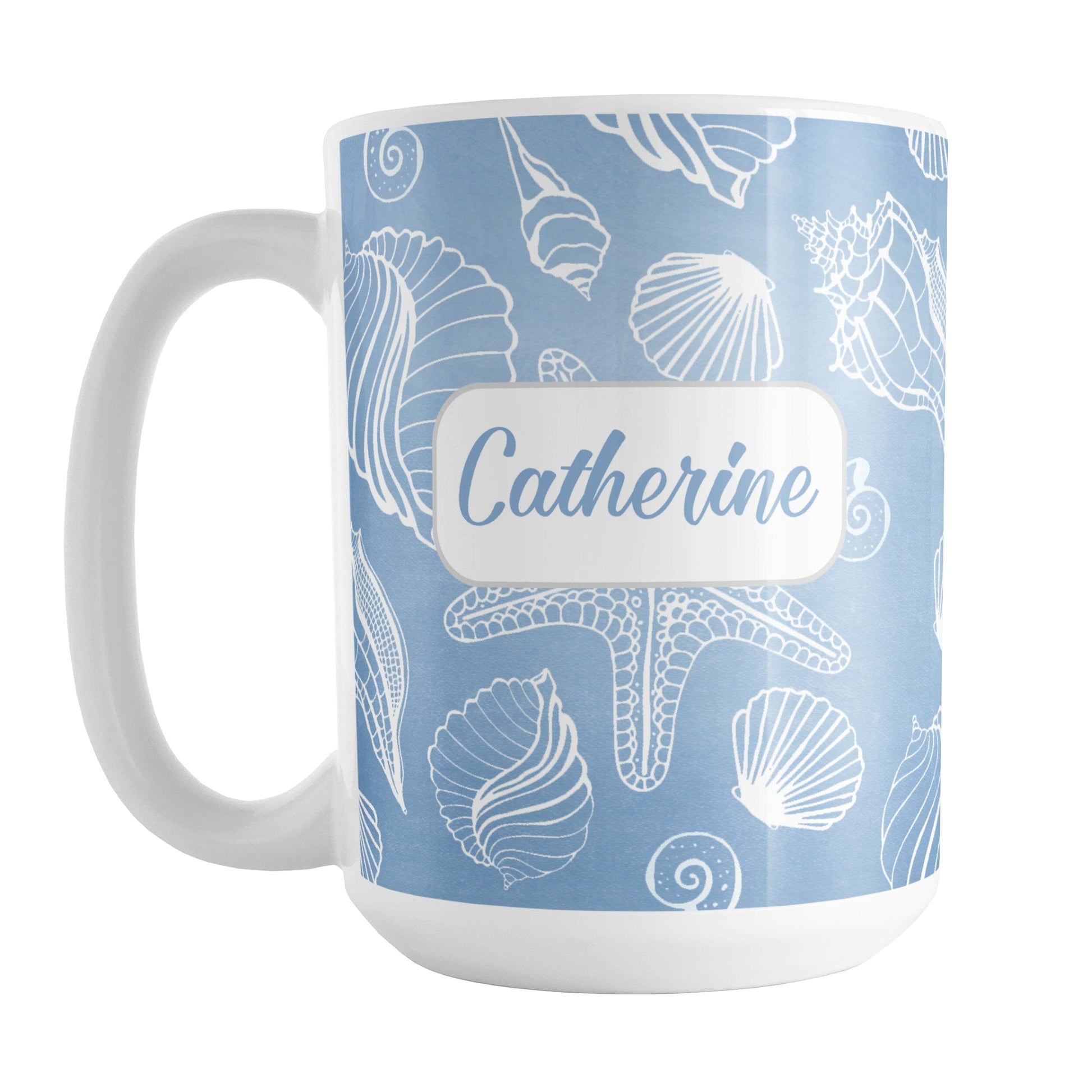 Personalized White Seashell Pattern Blue Beach Mug (15oz) at Amy's Coffee Mugs. A ceramic coffee mug designed with a white seashell line drawing pattern over a blue background that wraps around the mug up to the handle. Your name is personalized on this beach mug over the blue seashell pattern.