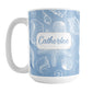 Personalized White Seashell Pattern Blue Beach Mug (15oz) at Amy's Coffee Mugs. A ceramic coffee mug designed with a white seashell line drawing pattern over a blue background that wraps around the mug up to the handle. Your name is personalized on this beach mug over the blue seashell pattern.