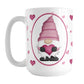 Pink Gnome Dainty Hearts Mug (15oz) at Amy's Coffee Mugs. A ceramic coffee mug designed with an adorable pink gnome in a white oval on both sides of the mug over a pattern of cute dainty hearts in different shades of pink that wrap around the mug to the handle.