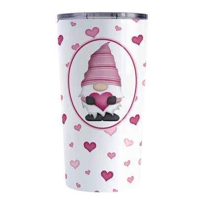 Pink Gnome Dainty Hearts Tumbler Cup (20oz) at Amy's Coffee Mugs. A stainless steel tumbler cup designed with an adorable pink gnome holding a heart in a white oval over a pattern of cute and dainty hearts in different shades of pink that wrap around the cup.