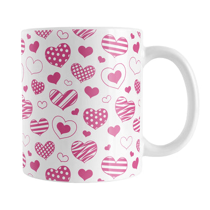 Pink Heart Doodles Mug (11oz) at Amy's Coffee Mugs. A ceramic coffee mug designed with hand-drawn pink heart doodles in a pattern that wraps around the cup. This cute heart pattern is perfect for Valentine's Day or for anyone who loves hearts and young-at-heart drawings. 