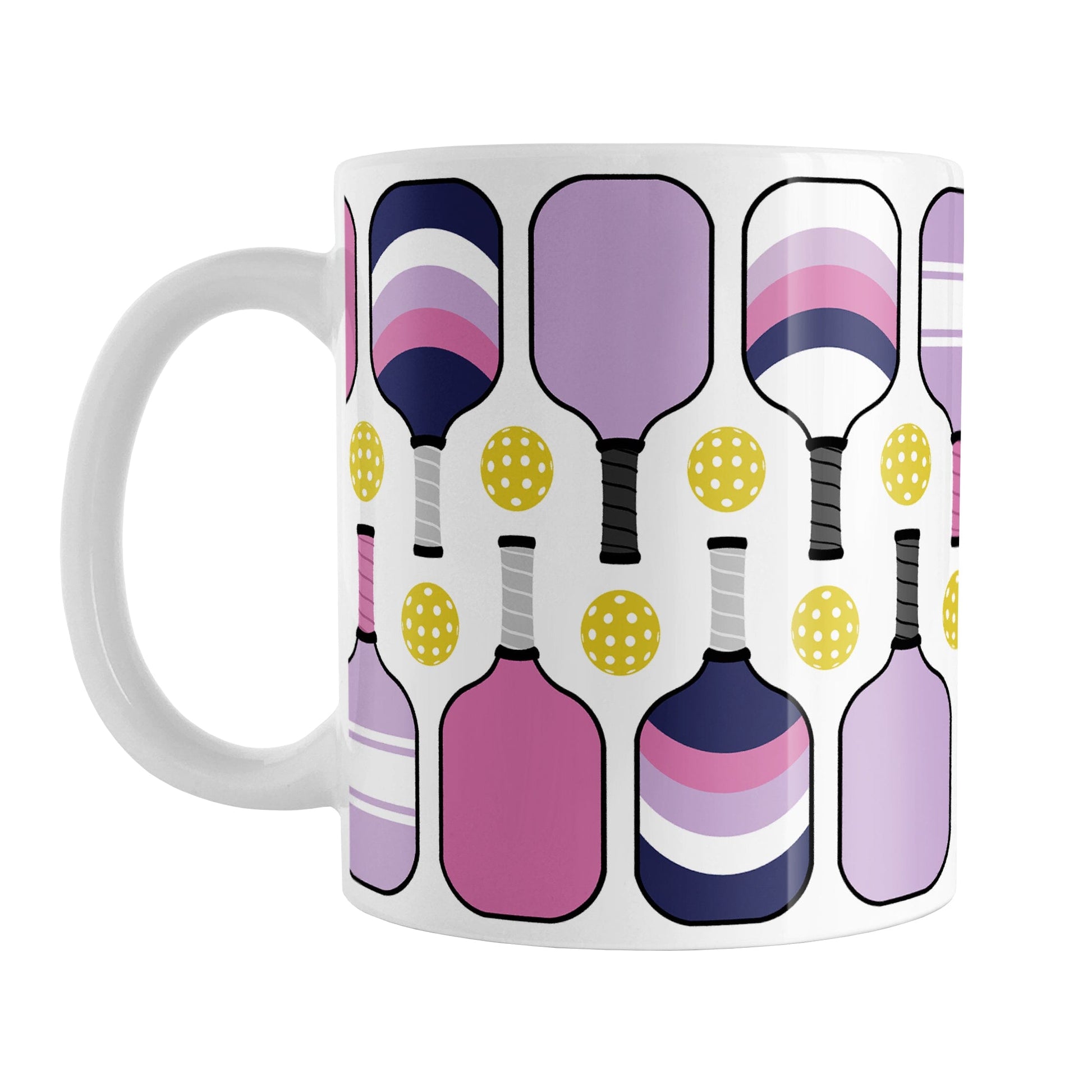Pink Purple Navy Pickleball Mug (11oz) at Amy's Coffee Mugs. A ceramic coffee mug designed with modern pickleball paddles in bold pink, light purple, and dark navy blue, along with yellow balls in a pattern that wraps around the mug up to the handle.