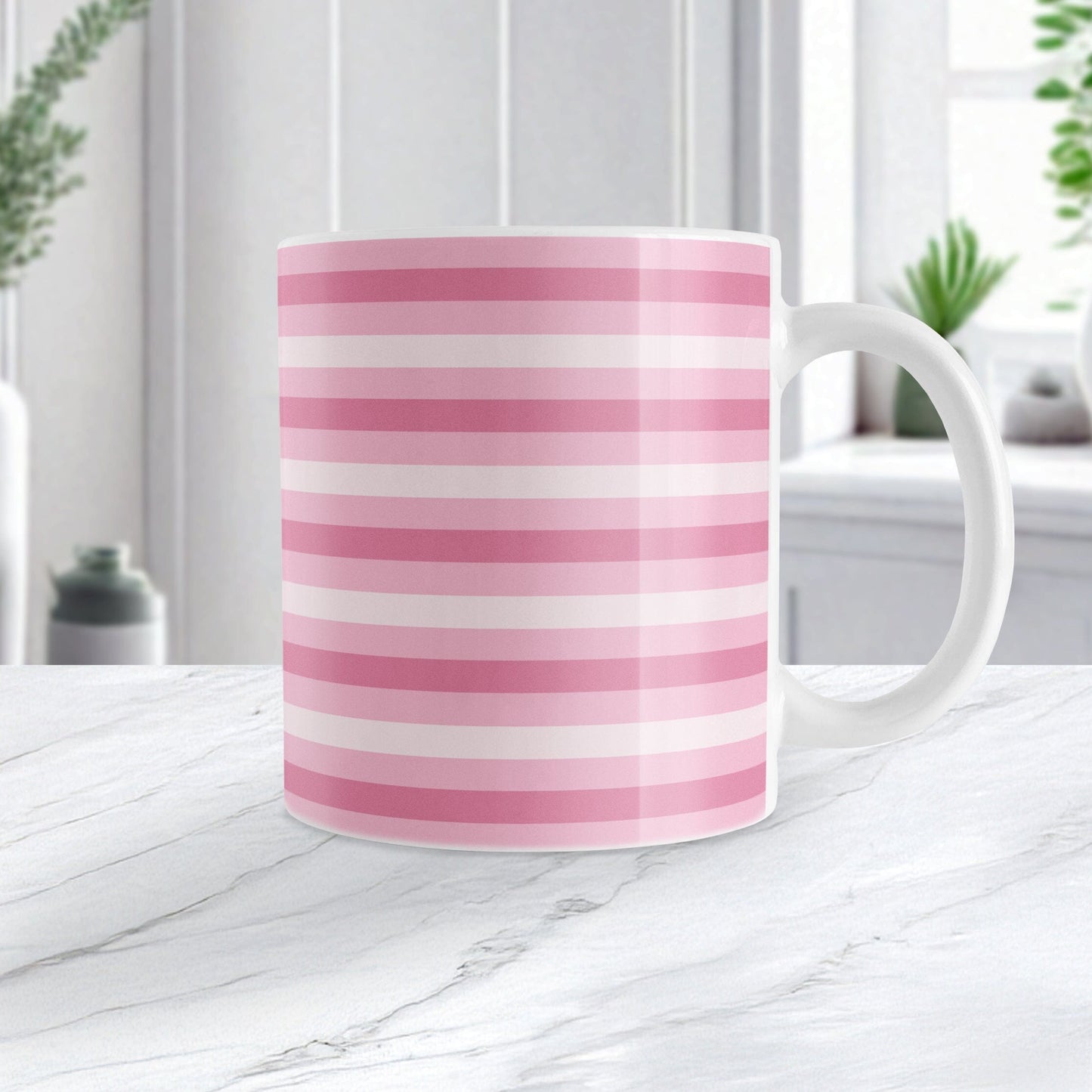 Mug with pink stripes on a marble surface