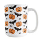 15oz white mug with Halloween-themed design featuring pumpkins, bats, and spiders on a white background.
