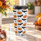 15 oz Halloween travel mug with orange jack-o'-lanterns, black bats, spiders, and gray spider webs, plus a black screw-on lid, on a granite countertop in a kitchen with fall decor including autumn plants, a pumpkin, and an orange plaid tea towel.