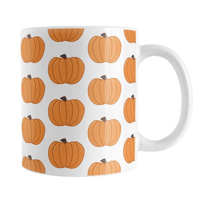 Pumpkins Mug (11oz) at Amy's Coffee Mugs. A ceramic coffee mug designed with illustrated orange pumpkins in a pattern that wraps around the mug to the handle.