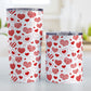 Red Heart Doodles Tumbler Cup (20oz or 10oz) at Amy's Coffee Mugs. Stainless steel tumbler cups designed with hand-drawn red heart doodles in a pattern that wraps around the cups. This cute heart pattern is perfect for Valentine's Day or for anyone who loves hearts and young-at-heart drawings. Photo shows both sized cups on a table next to each other.