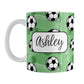 Soccer Ball and Goal Personalized Green Soccer Mug (11oz) at Amy's Coffee Mugs. A ceramic coffee mug designed with a pattern of soccer balls and white soccer goals over a green background with green circles. Your personalized name is custom-printed in a fun black script font on both sides of the mug over the soccer pattern. 
