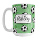 Soccer Ball and Goal Personalized Green Soccer Mug (15oz) at Amy's Coffee Mugs. A ceramic coffee mug designed with a pattern of soccer balls and white soccer goals over a green background with green circles. Your personalized name is custom-printed in a fun black script font on both sides of the mug over the soccer pattern. 
