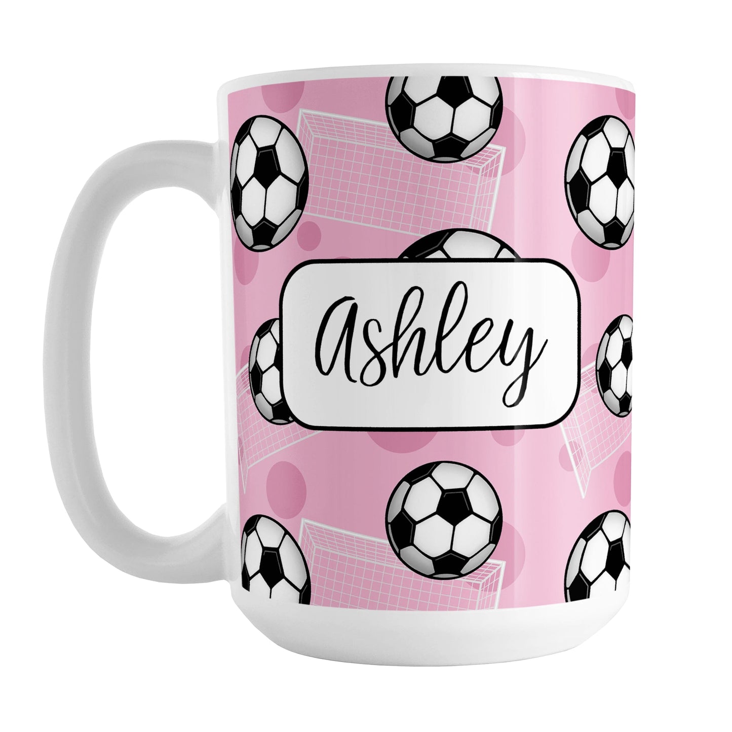 Soccer Ball and Goal Personalized Pink Soccer Mug (15oz) at Amy's Coffee Mugs. A ceramic coffee mug designed with a pattern of soccer balls and white soccer goals over a pink background with pink circles. Your personalized name is custom-printed in a fun black script font on both sides of the mug over the soccer pattern. 