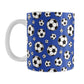 11oz white ceramic mug with a design of soccer balls over dark blue
