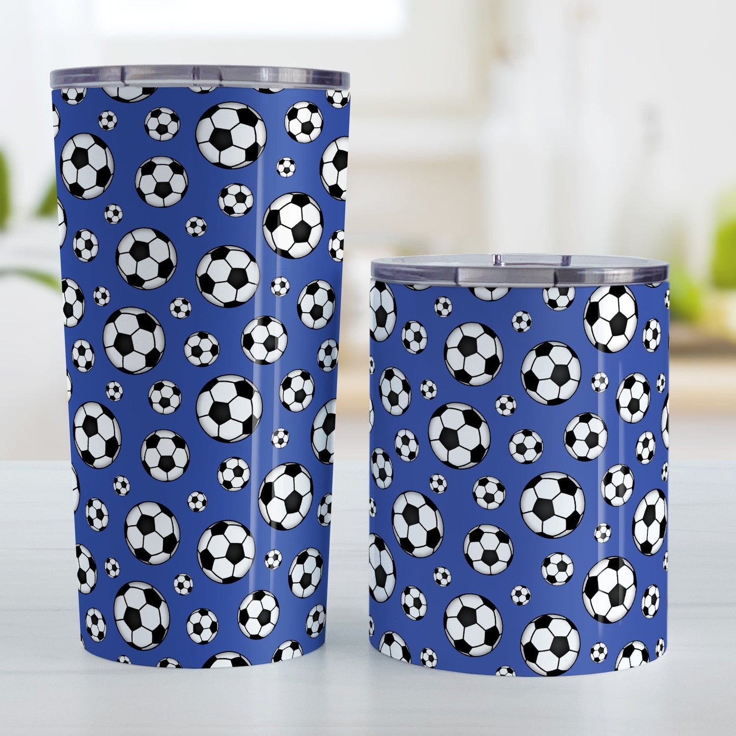 Soccer Balls on Dark Blue Tumbler Cup at Amy's Coffee Mugs. Photo shows the 20oz and 10oz cups next to each other.