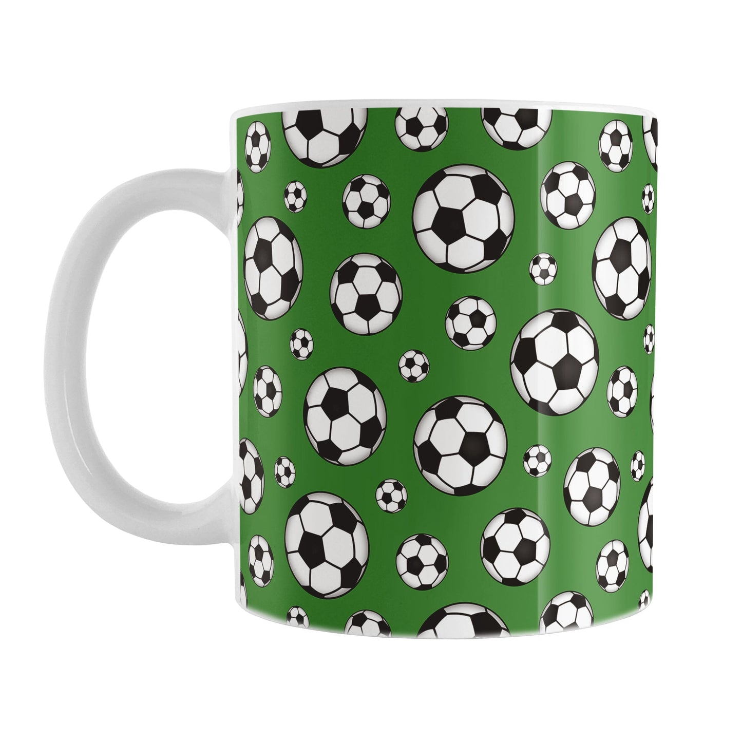 11oz white ceramic mug with a design of soccer balls over dark green