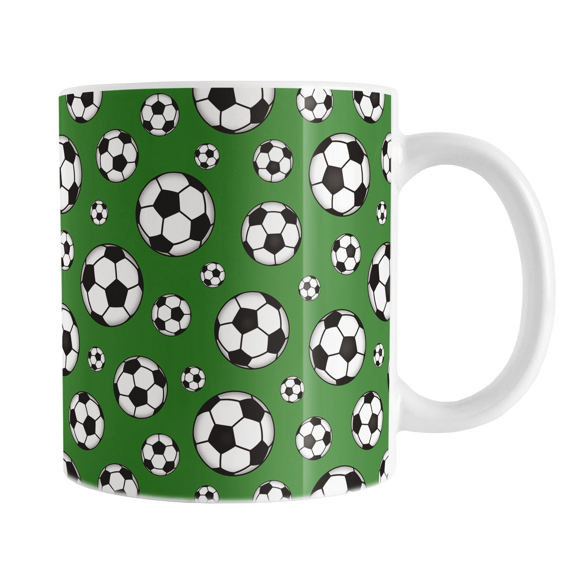 11oz white ceramic mug with a design of soccer balls over dark green