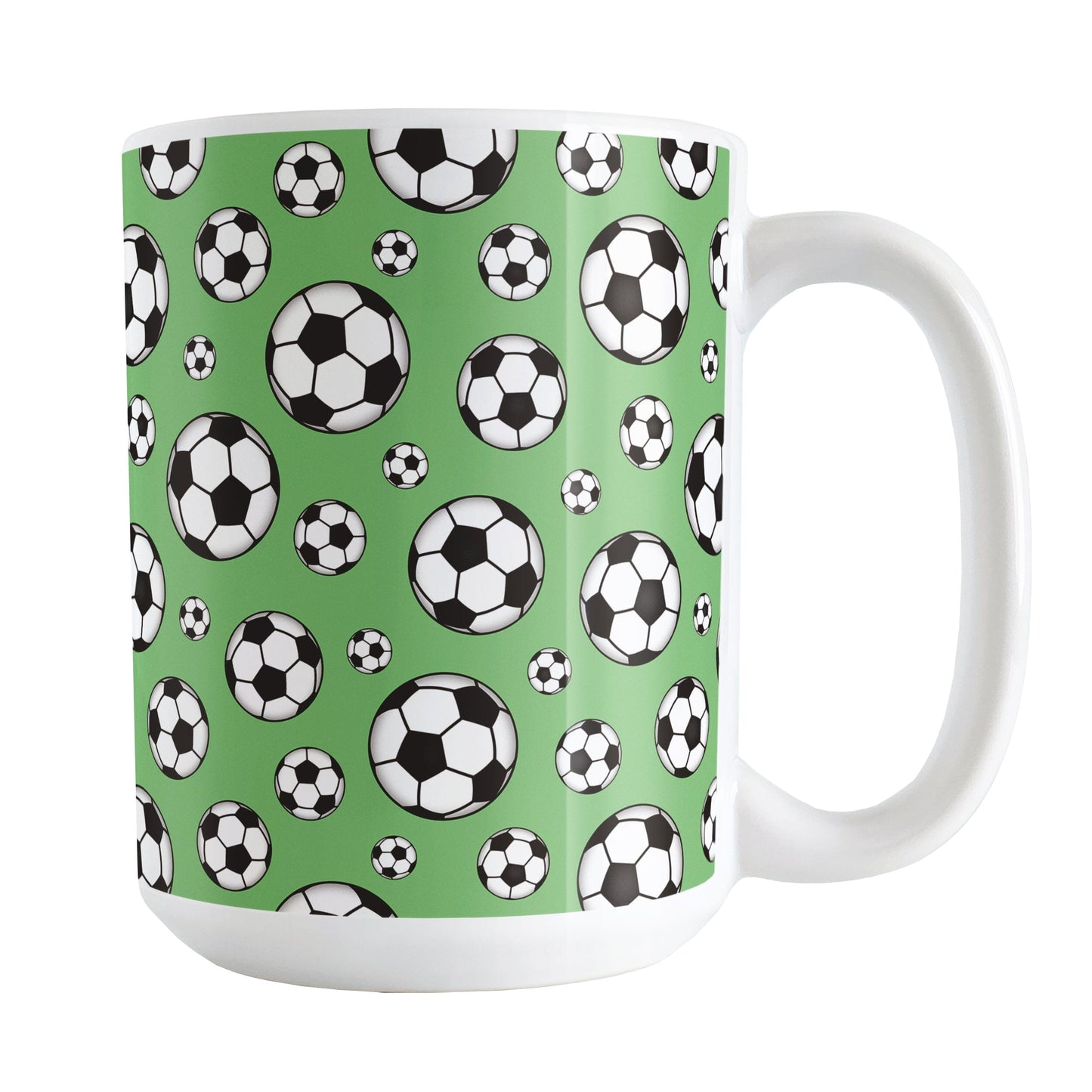 15oz white ceramic mug with a design of soccer balls over green