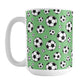 15oz white ceramic mug with a design of soccer balls over green