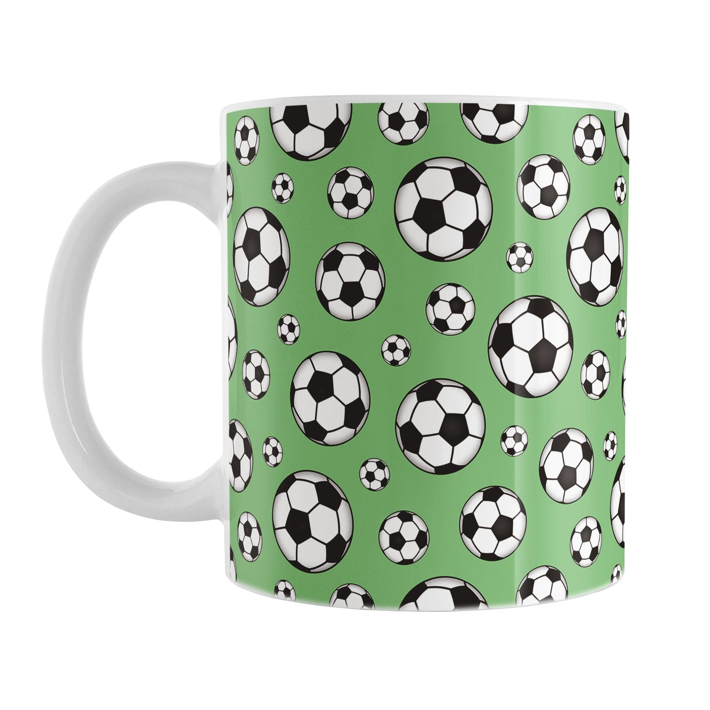 11oz white ceramic mug with a design of soccer balls over green