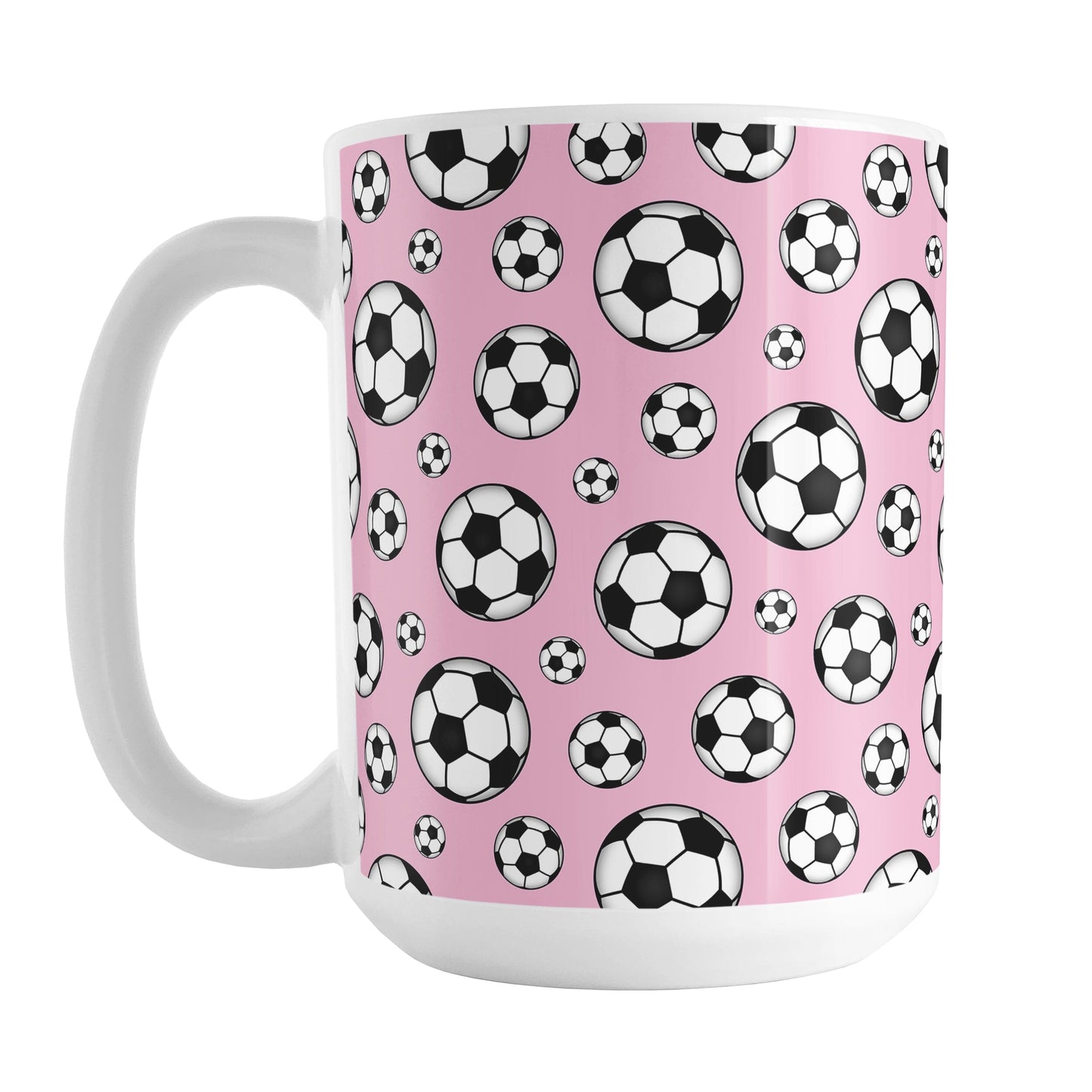 15oz white ceramic mug with a design of soccer balls over pink