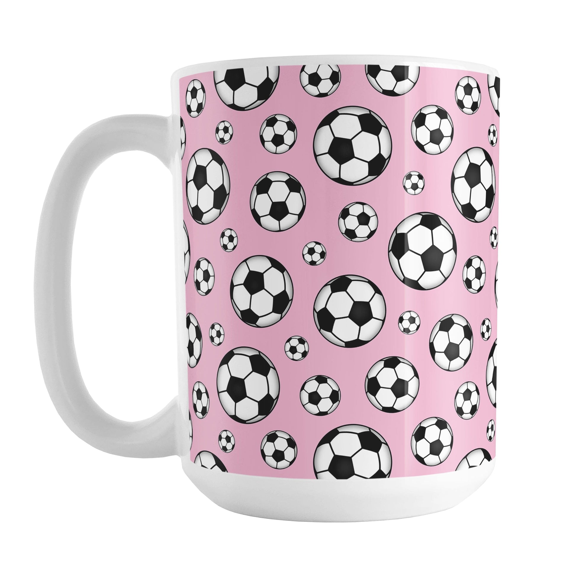 15oz white ceramic mug with a design of soccer balls over pink