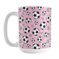 15oz white ceramic mug with a design of soccer balls over pink