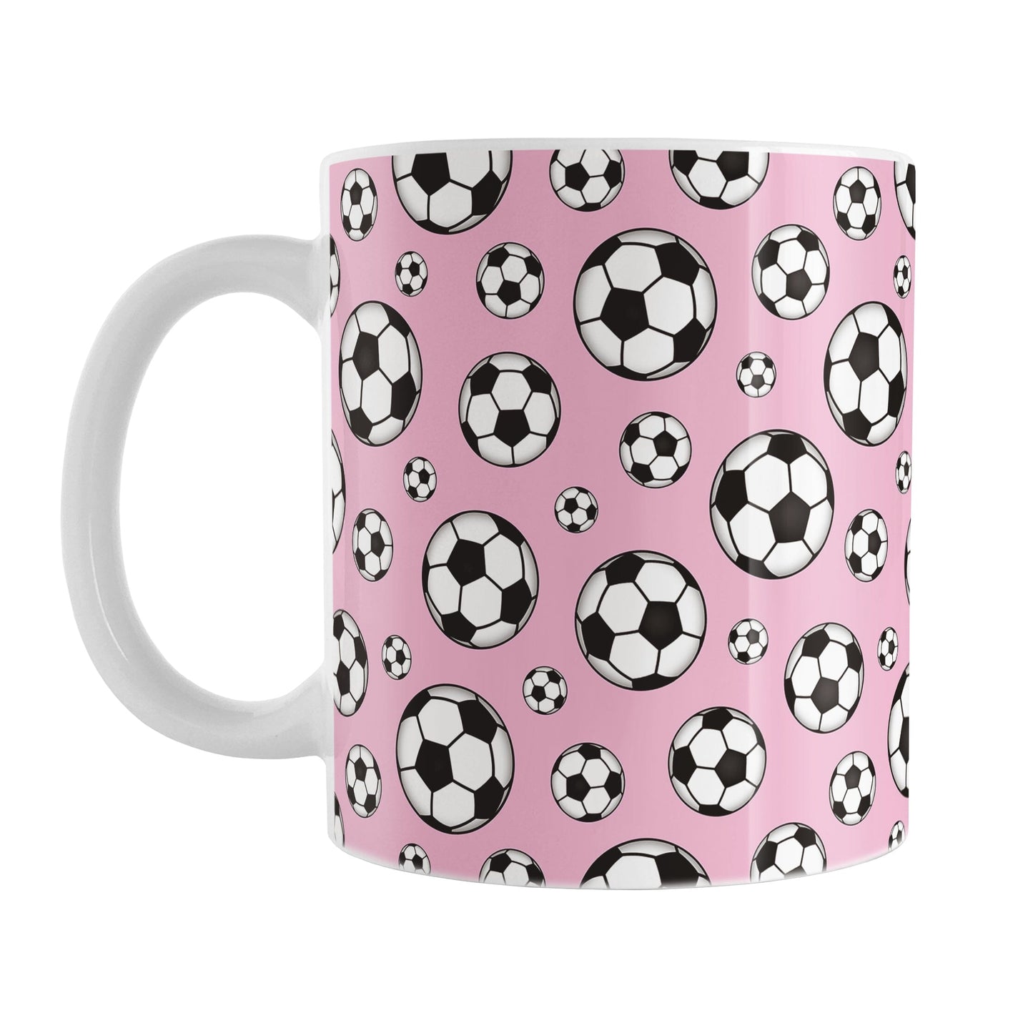 11oz white ceramic mug with a design of soccer balls over pink
