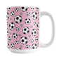 15oz white ceramic mug with a design of soccer balls over pink