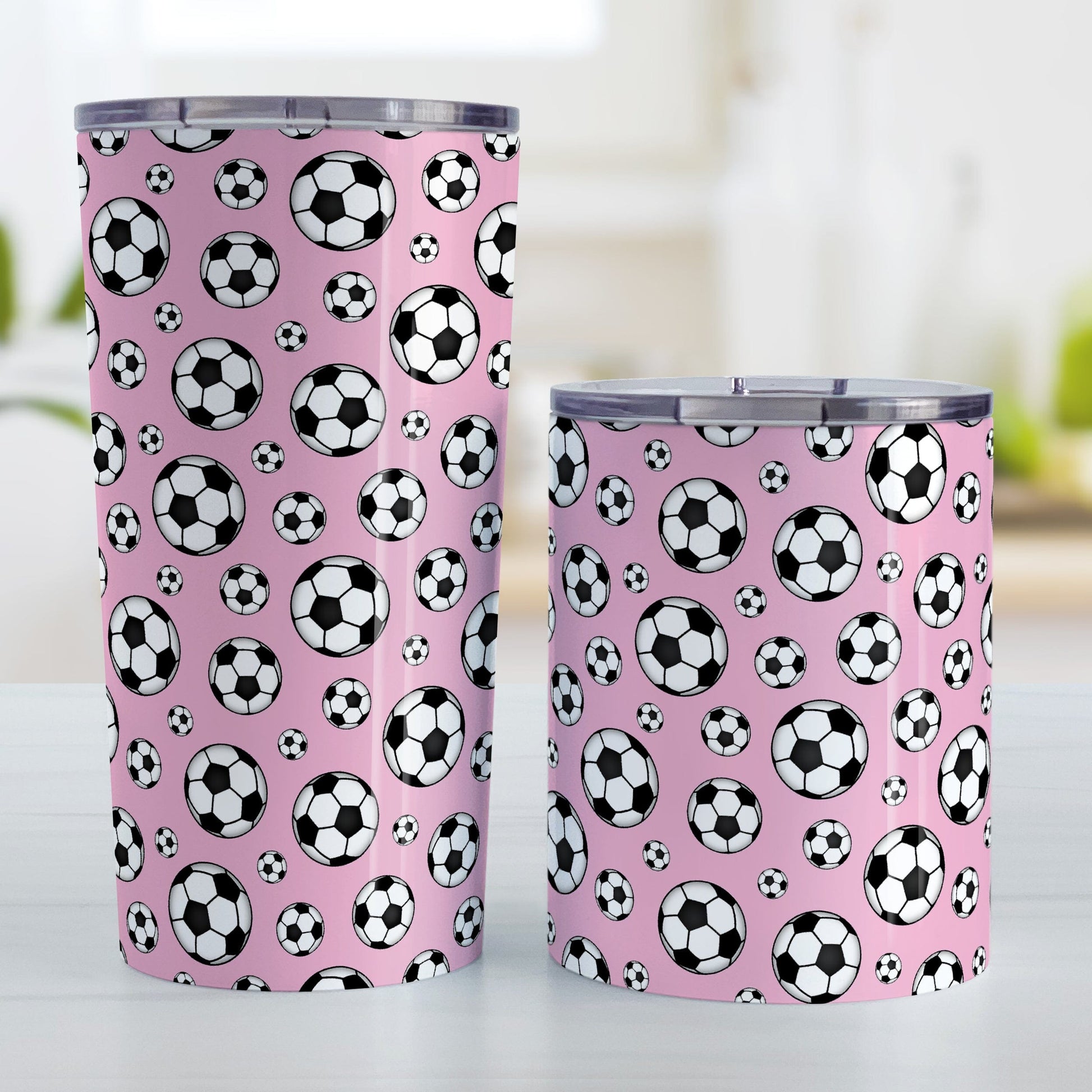 Soccer Balls on Pink Tumbler Cup at Amy's Coffee Mugs. Photo shows the 20oz cup and the 10oz cup next to each other.