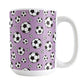 15oz white ceramic mug with a design of soccer balls over purple