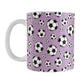 11oz white ceramic mug with a design of soccer balls over purple