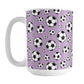15oz white ceramic mug with a design of soccer balls over purple