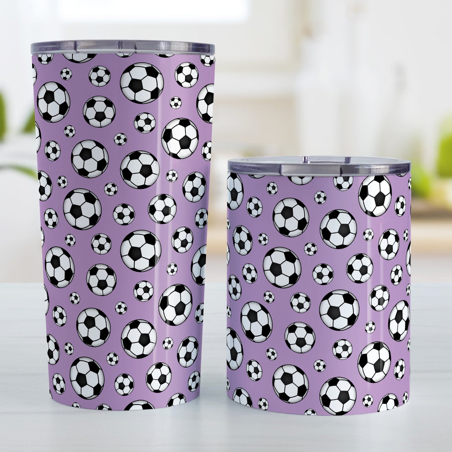 Soccer Balls on Purple Tumbler Cup at Amy's Coffee Mugs. 20oz cup and 10oz cup next to each other.
