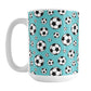15oz white ceramic mug with a design of soccer balls over teal