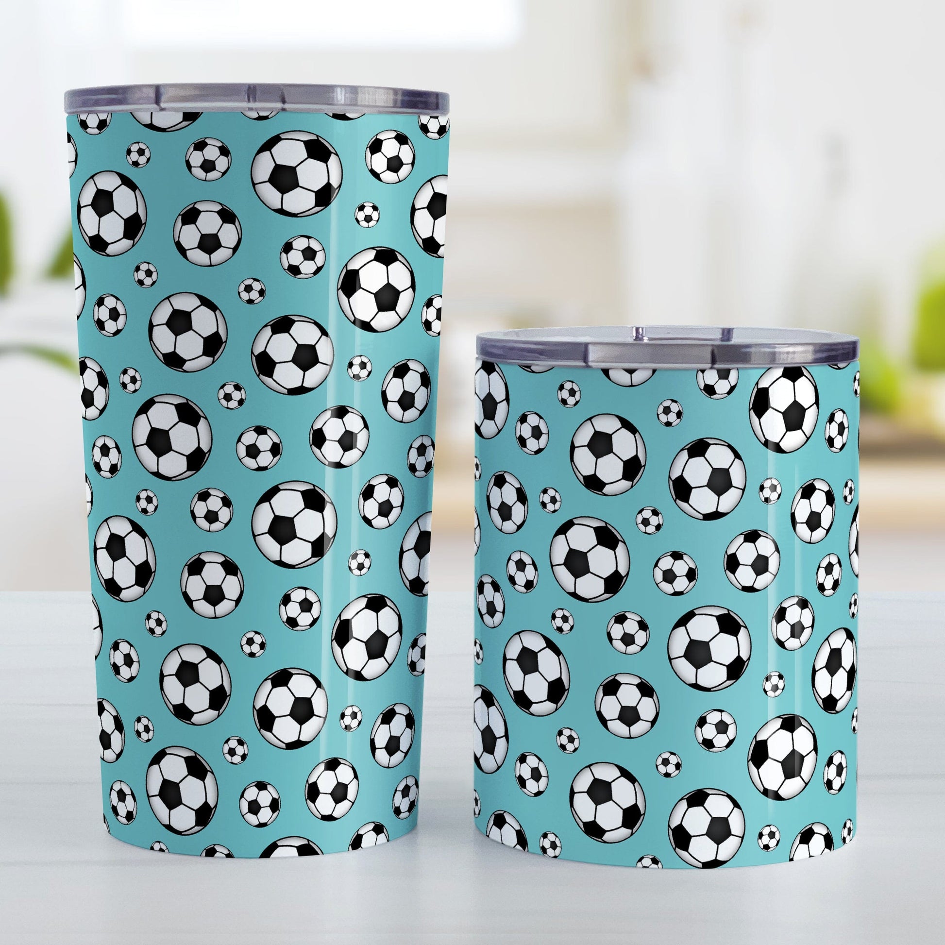 Soccer Balls on Teal Tumbler Cup at Amy's Coffee Mugs. Photo shows both sized cups next to each other.