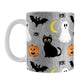 Spooky Cute Halloween Mug (11oz) at Amy's Coffee Mugs. A ceramic coffee mug designed with a cute black cat, ghost, jack o'lantern, crescent moon, bat, spider, and spider webs over a gray background color in a pattern that wraps around the mug up to the handle.