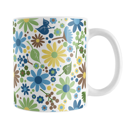 Sunny Summer Flowers Mug (11oz) at Amy's Coffee Mugs. A ceramic coffee mug designed with pretty floral wildflowers in a gorgeous summer color palette, with yellow, blue, green, and brown flowers and leaves in a pattern that wraps around the mug up to the handle.