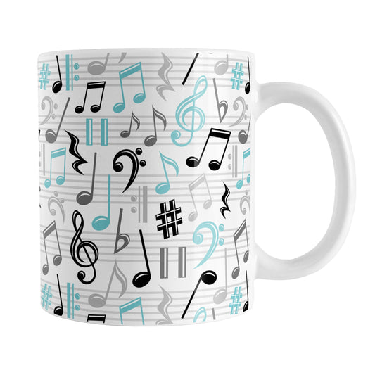 Turquoise Music Notes Pattern Mug (11oz) at Amy's Coffee Mugs. A ceramic coffee mug designed with music notes and symbols in turquoise, black, and gray in a pattern that wraps around the mug to the handle.