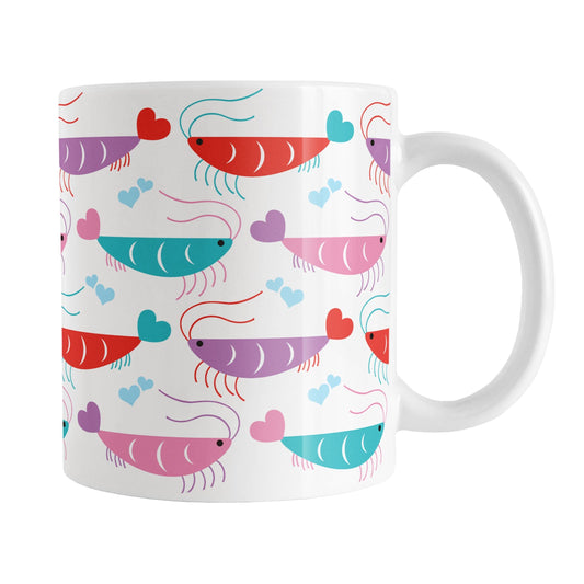 An 11oz white mug with a cute pattern of pink, purple, red, and teal shrimp, perfect for Valentine's Day