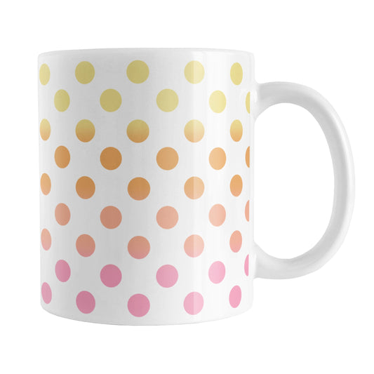 Warm Ombre Polka Dots Mug (11oz) at Amy's Coffee Mugs. A ceramic coffee mug designed with polka dots in a gradient color progression with yellow, orange, peach, and pink in a pattern that wraps around the mug to the handle.