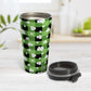 15oz travel mug with green and black checkered (buffalo plaid) pattern and white clovers, on a tabletop, open with the lid beside it