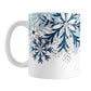 Winter Blue Silver Snowflake Mug (11oz) at Amy's Coffee Mugs. A ceramic coffee mug with navy blue, aqua blue, and silver-colored glitter-illustrated snowflakes along the top, cascading down most of the mug, over white. This wintry snowflake design wraps around the mug up to the handle.