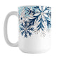 Winter Blue Silver Snowflake Mug (15oz) at Amy's Coffee Mugs. A ceramic coffee mug with navy blue, aqua blue, and silver-colored glitter-illustrated snowflakes along the top, cascading down most of the mug, over white. This wintry snowflake design wraps around the mug up to the handle.