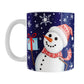 Winter Snowman Mug (11oz) at Amy's Coffee Mugs. A ceramic coffee mug designed with an illustration of a happy snowman wearing a red scarf and hat, while holding a blue gift box, over a winter night sky background with snowflakes around him.