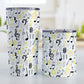 Yellow Music Notes Pattern Tumbler Cups (20oz or 10oz) at Amy's Coffee Mugs. Stainless steel tumbler cups designed with music notes and symbols in yellow, black, and gray in a pattern that wraps around the cups. Photo shows both sized cups on a table next to each other. 