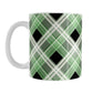 Alternative Green Plaid Mug (11oz) at Amy's Coffee Mugs. A ceramic coffee mug designed with a diagonal green, black, and white plaid pattern that wraps around the mug to the handle. Designed for someone who loves plaid patterns and is a fan of the color green.
