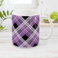 Alternative Purple Plaid Mug (11oz) at Amy's Coffee Mugs. A ceramic coffee mug designed with a diagonal purple, black, and white plaid pattern that wraps around the mug to the handle. Designed for someone who loves plaid patterns and the colors purple and black.